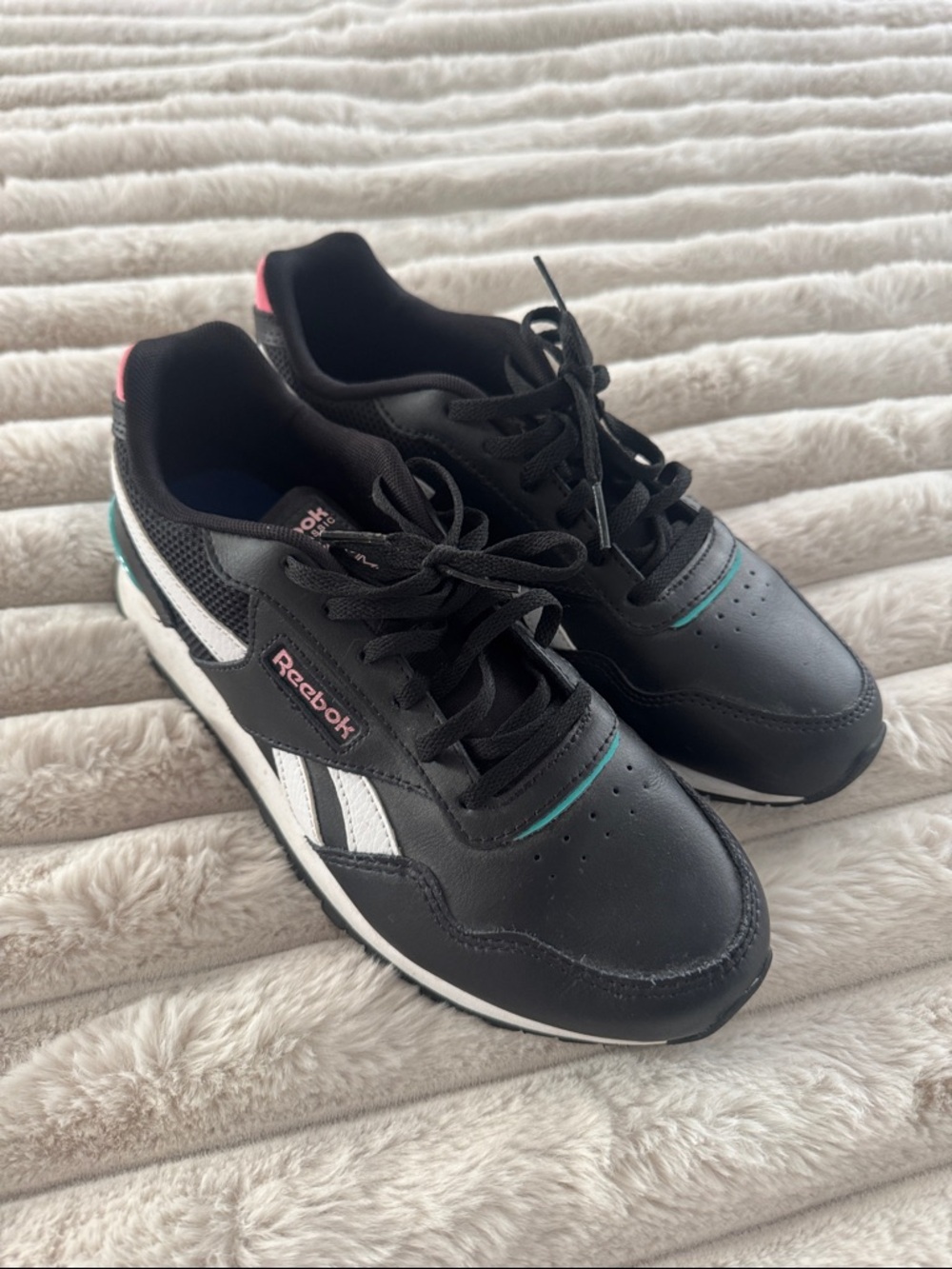 Reebok Black Sneakers with White Stripes and Pink Accents